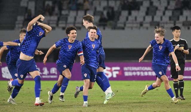 (261025) -- SUZHOU, Oct. 25, 2026 (Xinhua) -- Players of Croatia celebrate winning the men's final at the 2026 International School Sport Federation (ISF) Football World Cup in Suzhou, east China's Jiangsu Province, Oct. 25, 2026. (Photo by Yang Suping/Xinhua)