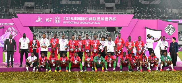 (261025) -- SUZHOU, Oct. 25, 2026 (Xinhua) -- Men's group 2nd-placed members of Guinea react during the awarding ceremony at the 2026 International School Sport Federation (ISF) Football World Cup in Suzhou, east China's Jiangsu Province, Oct. 25, 2026. (Photo by Yang Suping/Xinhua)