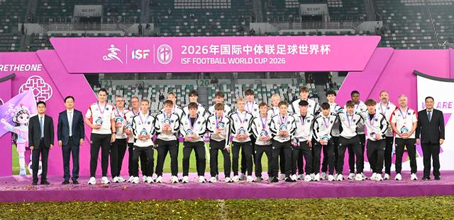(261025) -- SUZHOU, Oct. 25, 2026 (Xinhua) -- Men's group 3rd-placed members of Germany react during the awarding ceremony at the 2026 International School Sport Federation (ISF) Football World Cup in Suzhou, east China's Jiangsu Province, Oct. 25, 2026. (Photo by Yang Suping/Xinhua)