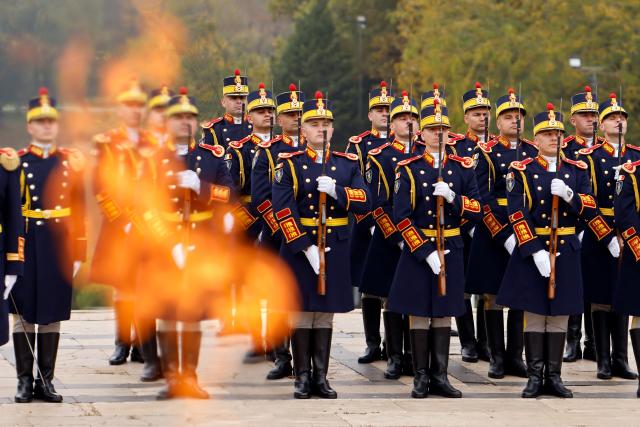(261025) -- BUCHAREST, Oct. 25, 2026 (Xinhua) -- Soldiers of an honor guard stand in attention during a ceremony marking Romania's Army Day at the Tomb of the Unknown Soldier in Bucharest in Bucharest, Romania, Oct. 25, 2026. (Photo by Cristian Cristel/Xinhua)