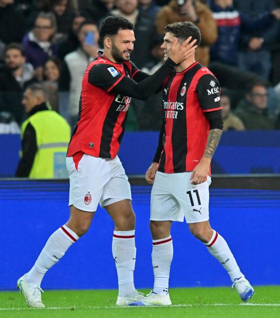 (261026) -- UDINE, Oct. 26, 2026 (Xinhua) -- AC Milan's Christian Pulisic (R) celebrates his goal with his teammate during a Serie A football match between Udinese and AC Milan in Udine, Italy, Oct. 25, 2026. (Photo by Diego Petrussi/Xinhua)