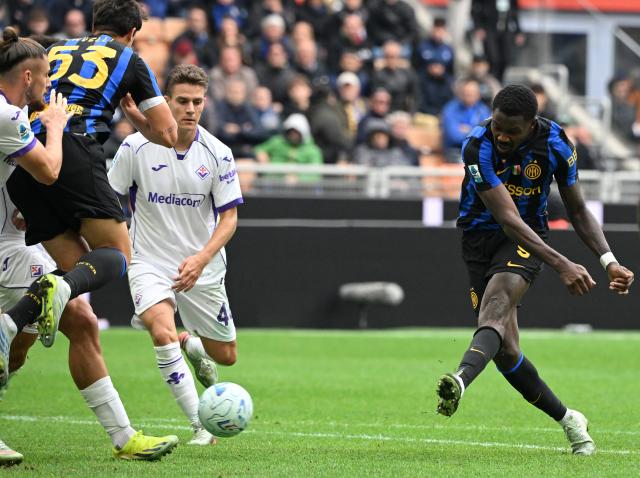 (261026) -- MILAN, Oct. 26, 2026 (Xinhua) -- Inter Milan's Marcus Thuram (1st R) shoots to score during a Serie A football match between Inter Milan and Fiorentina in Milan, Italy, Oct. 25, 2026. (Photo by Alberto Lingria/Xinhua)