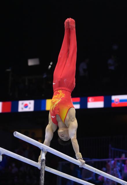 (261026) -- ROTTERDAM, Oct. 26, 2026 (Xinhua) -- Zou Jingyuan of China competes during the men's parallel bars final at the Artistic Gymnastics World Championships 2026 in Rotterdam, the Netherlands, Oct. 25, 2026. (Xinhua/Weng Xinyang)