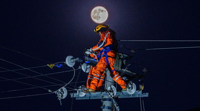 (261026) -- BEIJING, Oct. 26, 2026 (Xinhua) -- An electric worker is pictured at a resettlement site of a quake-hit village in Maru Township of Baqen County, Nagqu City, southwest China's Xizang Autonomous Region, Oct. 25, 2026. Power supply lines are being installed for prefabricated houses in the quake-hit Baqen County. According to the State Grid, power connection supplies for 2,724 tents and 2,400 prefabricated houses have been deployed to meet electricity connection needs in the quake-hit area. (Xinhua/Tenzin Nyida)