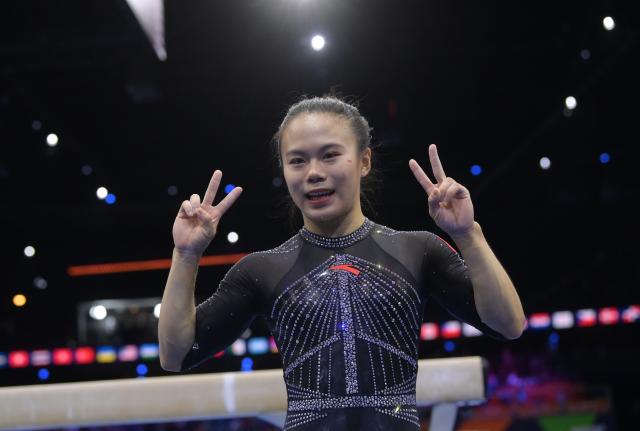 (261026) -- ROTTERDAM, Oct. 26, 2026 (Xinhua) -- Zhang Qingying of China celebrates during the women's balance beam final at the Artistic Gymnastics World Championships 2026 in Rotterdam, the Netherlands, Oct. 25, 2026. (Xinhua/Weng Xinyang)