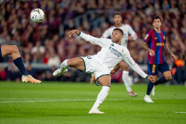 (261026) -- BARCELONA, Oct. 26, 2026 (Xinhua) -- Real Madrid CF's player Kylian Mbappe gets a chance to score during the La Liga football match between FC Barcelona and Real Madrid CF in Barcelona, Spain, on Oct. 25, 2026. (Photo by Joan Gosa/Xinhua)