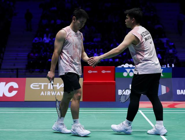 (261026) -- PARIS, Oct. 26, 2026 (Xinhua) -- Goh Sze Fei (L)/Nur Izzuddin of Malaysia react during the men's doubles final match between Man Wei Chong/Tee Kai Wun of Malaysia and Goh Sze Fei/Nur Izzuddin of Malaysia at the French Open badminton tournament in Paris, France, Oct. 25, 2026. (Xinhua/Wu Huiwo)