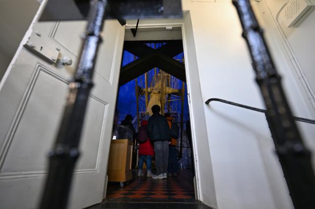 (261026) -- LONDON, Oct. 26, 2026 (Xinhua) -- Visitors view the Great Equatorial Telescope at the Royal Observatory in Greenwich, London, Britain, on Oct. 25, 2026. Installed in 1893, it is the largest refracting telescope in Britain and was used mainly to observe binary stars. The Royal Observatory in Greenwich was founded in 1675 to improve navigation at sea through astronomical observations and help ships determine their longitude. As the home of Greenwich Mean Time, it holds an important place in the history of astronomy, precision timekeeping and navigation. In 1884, the meridian passing through the observatory was adopted as the international Prime Meridian, establishing a common reference for measuring longitude worldwide. This historic line is still marked at the observatory today. (Xinhua/Li Mangmang)