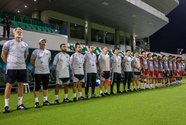 (261026) -- DOHA, Oct. 26, 2026 (Xinhua) -- The United Arab Emirates' head coach Peter Van Der Veen (1st L), the team's staff and substitutes line up before the Gulf Football Federation (GFF) Gulf Cup U-17 Qatar 2026 football match between China and the United Arab Emirates in Doha, Qatar, Oct. 25, 2026. (Photo by Nikku/Xinhua)