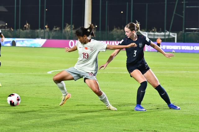 (261026) -- RABAT, Oct. 26, 2026 (Xinhua) -- Fang Zhenzhu (L) of China vies with Maddie Maves of the United States during the Group E match between China and the United States at the FIFA U-17 Women's World Cup, in Rabat, Morocco, on Oct. 25, 2026. (Photo by Aissa/Xinhua)