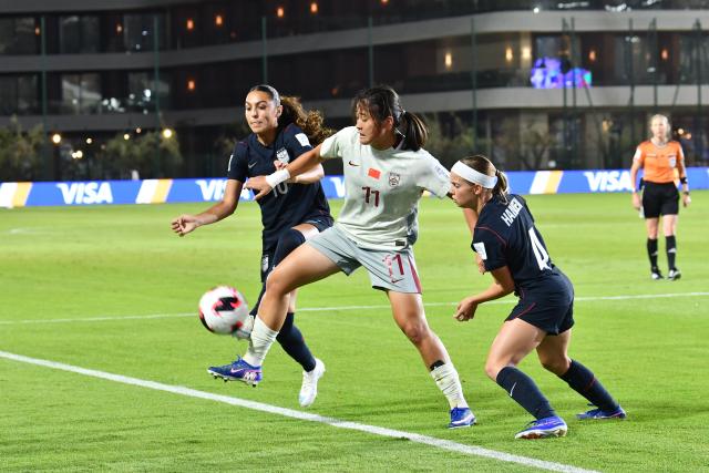 (261026) -- RABAT, Oct. 26, 2026 (Xinhua) -- Liu Yuxi (C) of China vies the ball with Mia Corona (L) and Kendra Hansen of the Unites States during the Group E match between China and the United States at the FIFA U-17 Women's World Cup, in Rabat, Morocco, on Oct. 25, 2026. (Photo by Aissa/Xinhua)