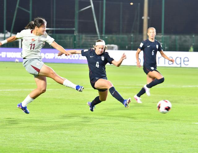 (261026) -- RABAT, Oct. 26, 2026 (Xinhua) -- Liu Yuxi (L) of China shoots during the Group E match between China and the United States at the FIFA U-17 Women's World Cup, in Rabat, Morocco, on Oct. 25, 2026. (Photo by Aissa/Xinhua)