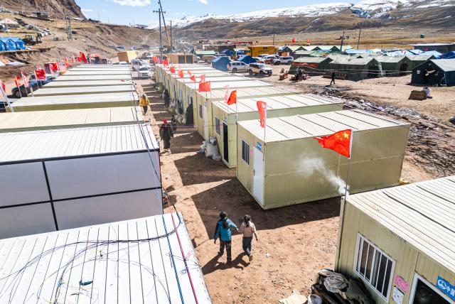 (261026) -- BAQEN, Oct. 26, 2026 (Xinhua) -- A drone photo taken on Oct. 26, 2026 shows prefabricated houses at a resettlement site of a quake-hit village in Maru Township of Baqen County, Nagqu City, southwest China's Xizang Autonomous Region.
  The first 60 prefabricated housing units in the earthquake zone were completed at 2:10 a.m. on Oct. 25, and electricity was connected to the units by 8 p.m. on the same day. (Xinhua/Tenzin Nyida)