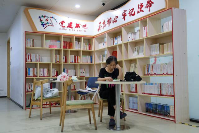 (261026) -- SHENZHEN, Oct. 26, 2026 (Xinhua) -- A resident reads at the book corner of Beizhan community public service center in Longhua District of Shenzhen, south China's Guangdong Province, Oct. 25, 2026. Shenzhen has been steadily improving the network and functions of its community public service centers since 2015, and has now built more than 4,400 such centers of various types. With each center covering a roughly one-kilometer, 15-minute walking radius, the network delivers all-age-friendly services to local residents, tourists, and foreign visitors.
   In recent years, the centers have regularly hosted a rich variety of cultural and recreational activities, and provided amenities including public reading rooms, nursery facilities and community canteens. Receiving over 400,000 visits every day across the network, they function as both convenient public service platforms and venues for community consultation and exchanges, bringing greater warmth to community-level urban governance. (Xinhua/Liang Xu)