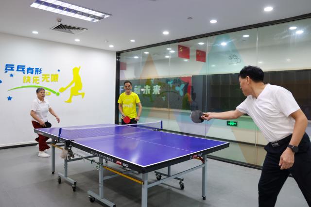 (261026) -- SHENZHEN, Oct. 26, 2026 (Xinhua) -- People play table tennis at Beizhan community public service center in Longhua District of Shenzhen, south China's Guangdong Province, Oct. 25, 2026. Shenzhen has been steadily improving the network and functions of its community public service centers since 2015, and has now built more than 4,400 such centers of various types. With each center covering a roughly one-kilometer, 15-minute walking radius, the network delivers all-age-friendly services to local residents, tourists, and foreign visitors.
   In recent years, the centers have regularly hosted a rich variety of cultural and recreational activities, and provided amenities including public reading rooms, nursery facilities and community canteens. Receiving over 400,000 visits every day across the network, they function as both convenient public service platforms and venues for community consultation and exchanges, bringing greater warmth to community-level urban governance. (Xinhua/Liang Xu)