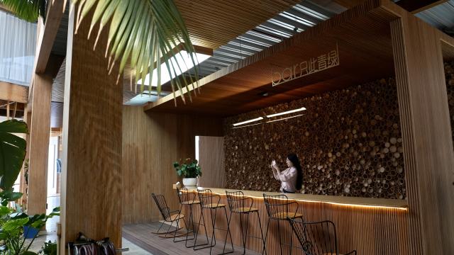 (261026) -- NANCHANG, Oct. 26, 2026 (Xinhua) -- A customer visits a bamboo bar counter at a bamboo company in Shangyou County, east China's Jiangxi Province, Oct. 26, 2026. Shangyou County in east China's Jiangxi is a major bamboo-producing area. In recent years, its industrial chain has expanded into high-value-added fields such as bamboo building, bamboo fiber, and bamboo charcoal. 
   As of December 2025, the county's bamboo industry had a total output value of 883 million yuan (about 131.5 million U.S. dollars), with products exported to over 30 countries and regions. (Xinhua/Hu Chenhuan)
