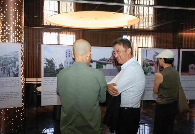 (261026) -- NAIROBI, Oct. 26, 2026 (Xinhua) -- People visit a photo exhibition marking the 81st anniversary of Taiwan's restoration to China, in Johannesburg, South Africa, Oct. 24, 2026. TO GO WITH "Roundup: African countries host photo exhibition marking Taiwan's restoration to China" (Xinhua/Chen Wei)