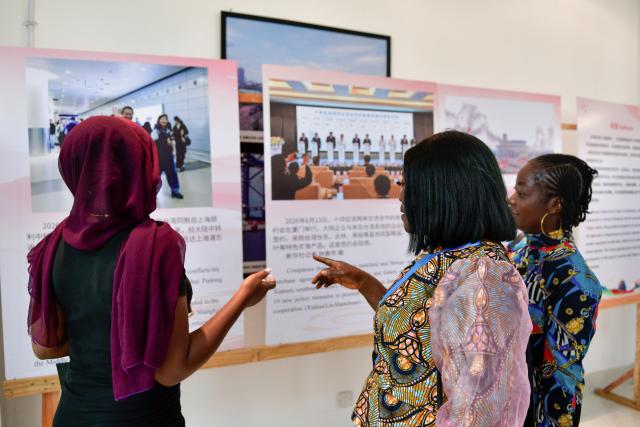 (261026) -- NAIROBI, Oct. 26, 2026 (Xinhua) -- People visit a photo exhibition marking the 81st anniversary of Taiwan's restoration to China, in Abuja, Nigeria, Oct. 23, 2026. TO GO WITH "Roundup: African countries host photo exhibition marking Taiwan's restoration to China" (Xinhua/Liu Jiaqi)