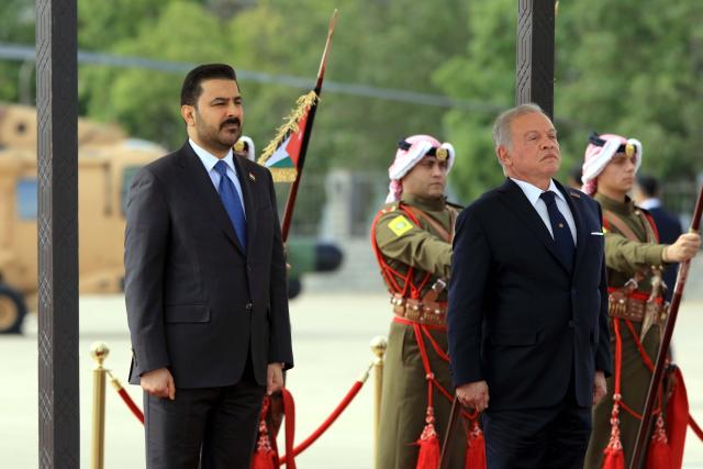 (261026) -- AMMAN, Oct. 26, 2026 (Xinhua) -- King Abdullah II of Jordan (R, front) holds welcome ceremony for visiting Iraqi Prime Minister Ali Al-Zaidi (L, front) at Marka Military Airport in Amman, Jordan, Oct. 26, 2026. (Photo by Mohammad Abu Ghosh/Xinhua)