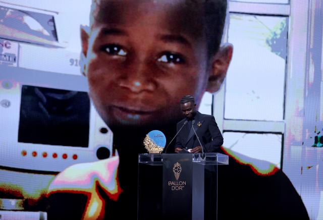 (261027) -- LONDON, Oct. 27, 2026 (Xinhua) -- Arsenal's Bukayo Saka speaks after winning the Socrates Trophy for most involved player in societal and charitable projects during the 2026 Ballon d'Or Football award ceremony in London, Britain, on Oct. 26, 2026. (Xinhua/Li Ying)