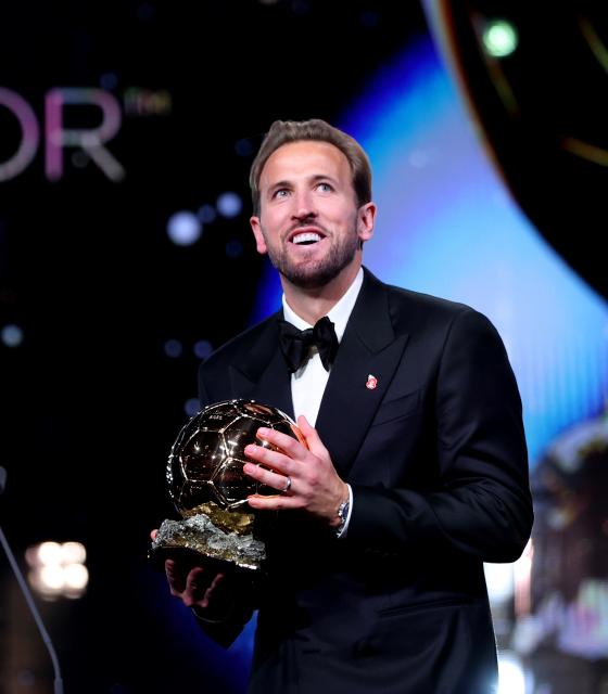 (261027) -- LONDON, Oct. 27, 2026 (Xinhua) -- Bayern Munich's Harry Kane reacts after winning the men's Ballon d'Or award during the 2026 Ballon d'Or Football award ceremony in London, Britain, on Oct. 26, 2026. (Xinhua/Li Ying)