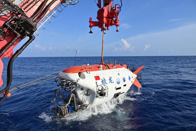 (261027) -- ABOARD RESEARCH VESSEL DEEP SEA NO. 1, Oct. 27, 2026 (Xinhua) -- The manned submersible Jiaolong is pictured after its 465th dive operation on Oct. 2, 2026. The dive reached a depth of 7,056.9 meters. China's manned submersible Jiaolong recently completed multiple 7,000-meter dive tests and returned safely, reaching a maximum depth of 7,056.9 meters. (Xinhua/Li Xin)