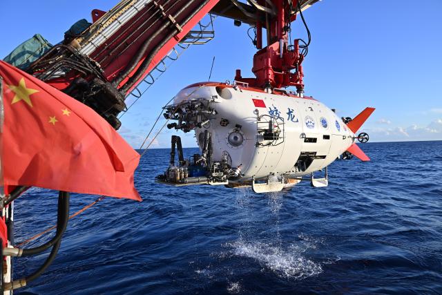 (261027) -- ABOARD RESEARCH VESSEL DEEP SEA NO. 1, Oct. 27, 2026 (Xinhua) -- The manned submersible Jiaolong is pictured after its 464th dive operation on Sept. 30, 2026. The dive reached a depth of 7,035.3 meters. China's manned submersible Jiaolong recently completed multiple 7,000-meter dive tests and returned safely, reaching a maximum depth of 7,056.9 meters. (Xinhua/Ye Haoming)