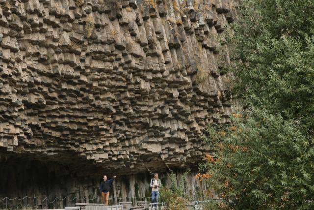 (261027) -- KOTAYK, Oct. 27, 2026 (Xinhua) -- People visit the Garni Gorge in Kotayk, Armenia, Oct. 25, 2026. The Garni Gorge is known for the distinctive basalt columns on the cliff walls along the sides of the gorge. (Xinhua/Chen Junfeng)