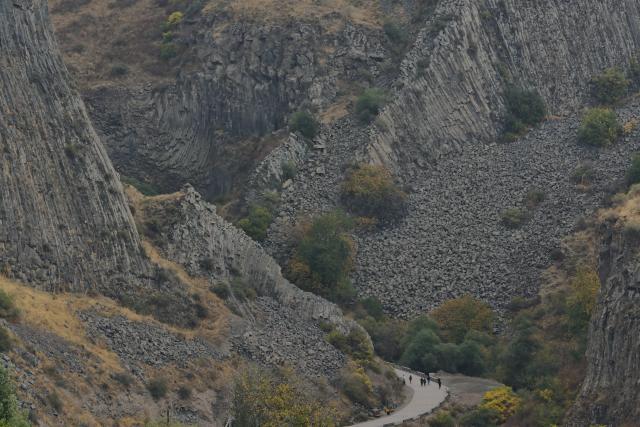 (261027) -- KOTAYK, Oct. 27, 2026 (Xinhua) -- People visit the Garni Gorge in Kotayk, Armenia, Oct. 25, 2026. The Garni Gorge is known for the distinctive basalt columns on the cliff walls along the sides of the gorge. (Xinhua/Chen Junfeng)