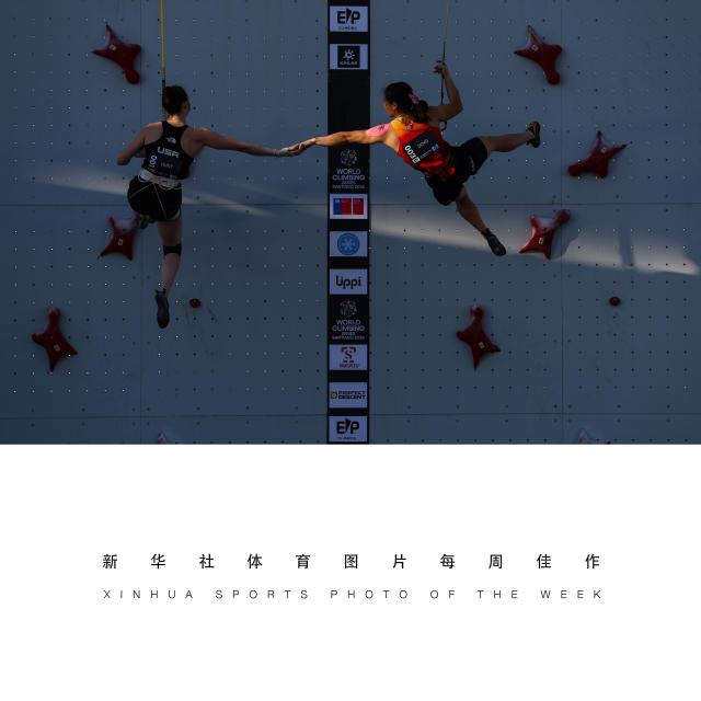 (261027) -- BEIJING, Oct. 27, 2026 (Xinhua) -- XINHUA SPORTS PHOTO OF THE WEEK (from Oct. 19 to Oct. 25, 2026) TRANSMITTED on Oct. 27, 2026. Deng Lijuan (R) of China and Emma Hunt of the United States greet each other after the women's speed gold medal race at the World Climbing Series Santiago 2026 in Santiago, Chile, Oct. 24, 2026. (Xinhua/Zhou Jiayi)