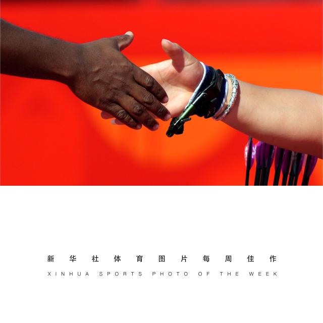 (261027) -- BEIJING, Oct. 27, 2026 (Xinhua) -- XINHUA SPORTS PHOTO OF THE WEEK (from Oct. 19 to Oct. 25, 2026) TRANSMITTED on Oct. 27, 2026. Ai Xinliang (R) of China shakes hands with Toman Kumar of India after the Para Archery men's compound doubles bronze medal match at the Aichi-Nagoya Asian Para Games in Okazaki, Japan, Oct. 21, 2026. (Xinhua/Cai Yang)