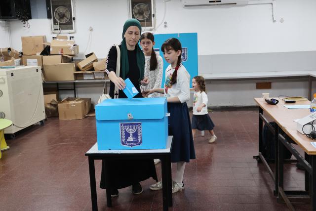 (261027) -- JERUSALEM, Oct. 27, 2026 (Xinhua) -- A voter casts her ballot at a polling station in Bnei Brak, central Israel, on Oct. 27, 2026. Voting in Israel's parliamentary election began at 7 a.m. local time (0500 GMT) on Tuesday, with Prime Minister Benjamin Netanyahu's political future in focus. (Photo by Gil Cohen Magen/Xinhua)