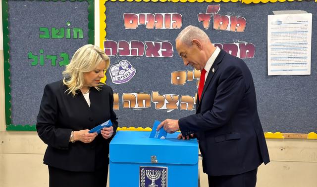 (261027) -- JERUSALEM, Oct. 27, 2026 (Xinhua) -- Israeli Prime Minister Benjamin Netanyahu (R) casts his ballot at a polling station in Jerusalem on Oct. 27, 2026. Voting in Israel's parliamentary election began at 7 a.m. local time (0500 GMT) on Tuesday, with Prime Minister Benjamin Netanyahu's political future in focus. (Israel's Government Press Office/Handout via Xinhua)