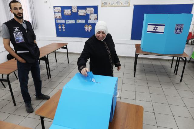 (261027) -- JERUSALEM, Oct. 27, 2026 (Xinhua) -- A voter casts her ballot at a polling station in Umm al-Fahm, northern Israel, on Oct. 27, 2026. Voting in Israel's parliamentary election began at 7 a.m. local time (0500 GMT) on Tuesday, with Prime Minister Benjamin Netanyahu's political future in focus. (Photo by Jamal Awad/Xinhua)