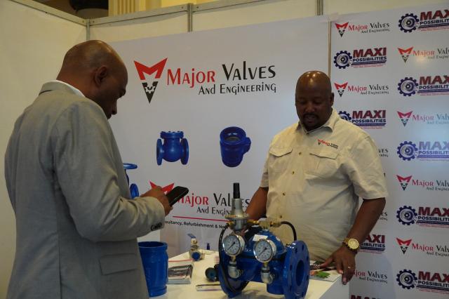 (261027) -- GABORONE, Oct. 27, 2026 (Xinhua) -- A participant of the Botswana Mining Show visits an exhibitor's stall at the Gaborone International Convention Center in Gaborone, Botswana, Oct. 27, 2026. Botswana's mining sector must be a catalyst for broader national transformation, extending beyond the extraction of minerals to the empowerment of people, said Botswana's Minister for State President, Defense and Security Moeti Mohwasa on Tuesday. TO GO WITH "Botswana taps mining as catalyst for national transformation, citizen empowerment" (Xinhua/Guo Chunju)