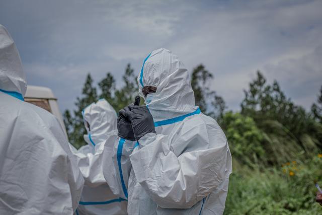 (261027) -- RWAMPARA, Oct. 27, 2026 (Xinhua) -- Medical workers put on protective suits in Rwampara, Ituri Province in the Democratic Republic of the Congo, Oct. 27, 2026. Ebola cases in the Democratic Republic of the Congo (DRC) have surpassed 10,000, marking a grim milestone in what has become the world's second-largest recorded Ebola outbreak.
   The latest figures released Tuesday by the country's health authorities showed that the country had recorded a total of 10,060 confirmed cases, including 4,887 deaths, as of Oct. 25, with the fatality rate at 48.6 percent. (Str/Xinhua)