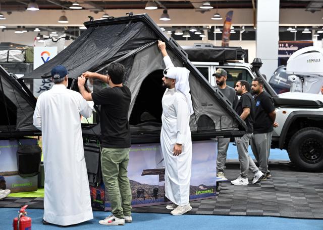 (261027) -- HAWALLI GOVERNORATE, Oct. 27, 2026 (Xinhua) -- People visit an international exhibition featuring camping, marine activities and outdoor sports in Hawalli Governorate, Kuwait, Oct. 27, 2026. The five-day exhibition brings together more than 100 local, regional and international exhibitors, showcasing over 500 brands and more than 20,000 products. (Photo by Asad/Xinhua)