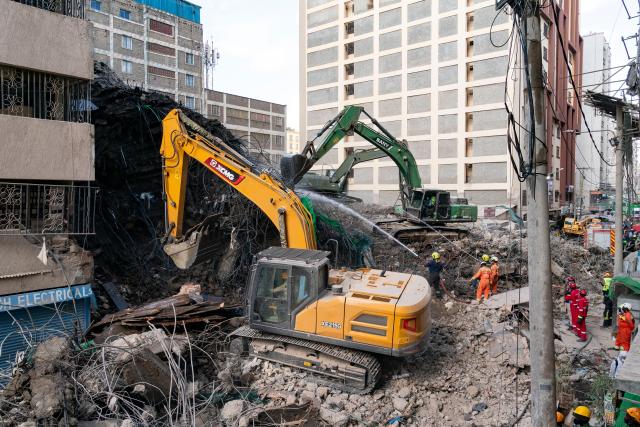 (261028) -- NAIROBI, Oct. 28, 2026 (Xinhua) -- Machineries provided by Chinese companies are seen at the site of a building collapse in Eastleigh, Nairobi, Kenya, on Oct. 27, 2026. TO GO WITH "Chinese rescue team detects signs of life beneath collapsed building in Kenya's Nairobi" (Xinhua/Xie Jianfei)