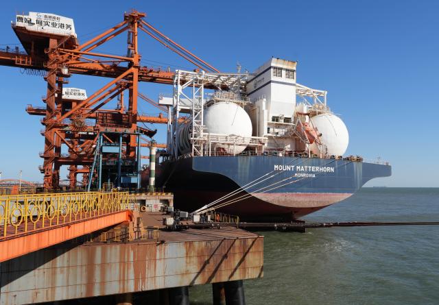 (261028) -- TANGSHAN, Oct. 28, 2026 (Xinhua) -- A vessel unloads at the ore terminal of Caofeidian Port Area in Tangshan Port in Tangshan, north China's Hebei Province, Oct. 27, 2026. Tangshan Port handled a total cargo throughput of 665.89 million tonnes in the first three quarters of 2026, marking a 2.01 percent year-on-year growth, according to the local port administration. (Xinhua/Yang Shiyao)