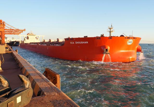 (261028) -- TANGSHAN, Oct. 28, 2026 (Xinhua) -- A vessel is about to dock at the ore terminal of Caofeidian Port Area in Tangshan Port in Tangshan, north China's Hebei Province, Oct. 27, 2026. Tangshan Port handled a total cargo throughput of 665.89 million tonnes in the first three quarters of 2026, marking a 2.01 percent year-on-year growth, according to the local port administration. (Xinhua/Yang Shiyao)