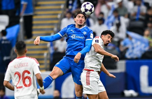 (261028) -- AL KHOR, Oct. 28, 2026 (Xinhua) -- Baghdad Bounedjah (R) of Al Shamal SC vies with Yusuf Akcicek of Al Hilal SFC during the AFC Champions League Elite football match between Qatar's Al Shamal SC and Saudi Arabia's Al Hilal SFC at Al Bayt Stadium, Al Khor, Qatar, Oct. 27, 2026. (Photo by Nikku/Xinhua)