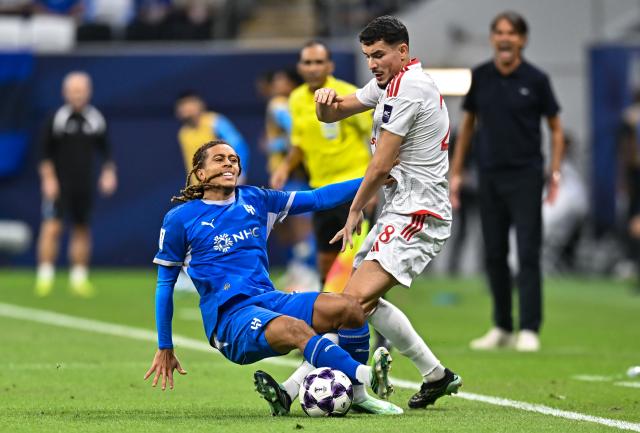 (261028) -- AL KHOR, Oct. 28, 2026 (Xinhua) -- Ali Asad (R) of Al Shamal SC vies with Sai Mon Bouabre of Al Hilal SFC during the AFC Champions League Elite football match between Qatar's Al Shamal SC and Saudi Arabia's Al Hilal SFC at Al Bayt Stadium, Al Khor, Qatar, Oct. 27, 2026. (Photo by Nikku/Xinhua)