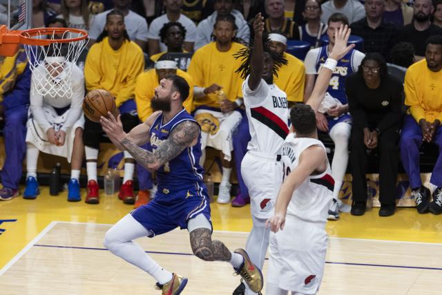 (261028) -- LOS ANGELES, Oct. 28, 2026 (Xinhua) -- Sandro Mamukelashvili (L) of Los Angeles Lakers goes for a lay up during the NBA basketball game between Los Angeles Lakers and Portland Trail Blazers in Los Angeles, the United States, Oct. 27, 2026. (Photo by Ringo Chiu/Xinhua)