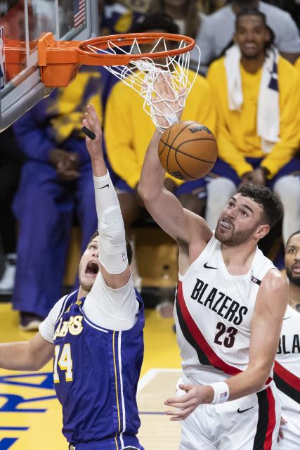 (261028) -- LOS ANGELES, Oct. 28, 2026 (Xinhua) -- Walker Kessler (L) of Los Angeles Lakers and Donovan Clingan of Portland Trail Blazers vie for a rebound during the NBA basketball game between Los Angeles Lakers and Portland Trail Blazers in Los Angeles, the United States, Oct. 27, 2026. (Photo by Ringo Chiu/Xinhua)