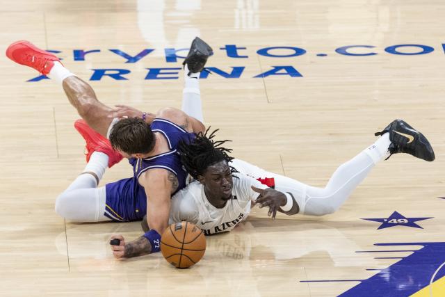 (261028) -- LOS ANGELES, Oct. 28, 2026 (Xinhua) -- Luka Doncic (L) of Los Angeles Lakers and Sidy Cissoko of Portland Trail Blazers vie for the ball during the NBA basketball game between Los Angeles Lakers and Portland Trail Blazers in Los Angeles, the United States, Oct. 27, 2026. (Photo by Ringo Chiu/Xinhua)