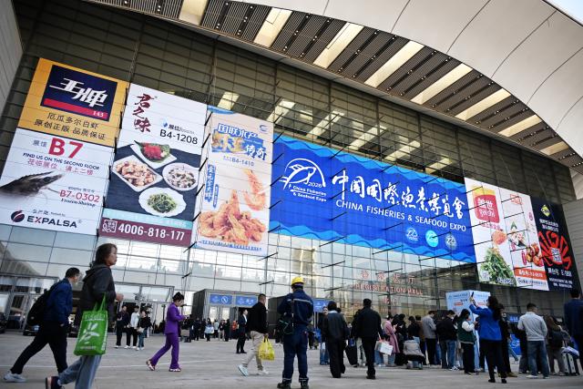 (261028) -- QINGDAO, Oct. 28, 2026 (Xinhua) -- People visit the 29th China Fisheries & Seafood Expo in Qingdao, east China's Shandong Province, Oct. 28, 2026. The expo kicked off here on Wednesday, with an exhibition area of approximately 120,000 square meters, showcasing exhibits covering aquatic raw materials and processed products, aquaculture and processing technologies and equipment, and cold chain logistics facilities. The expo, which will last until Oct. 30, has attracted numerous domestic and international manufacturers and buyers to seek business opportunities. (Xinhua/Li Ziheng)