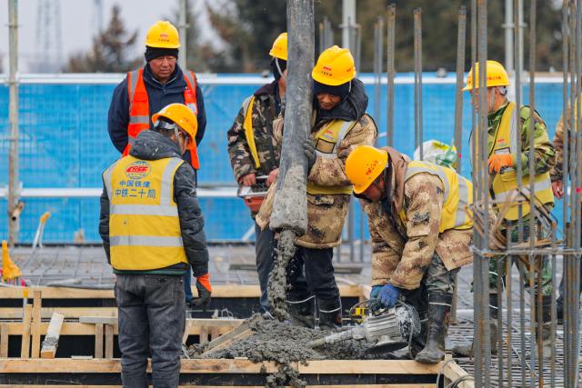 (261028) -- QIQIHAR, Oct. 28, 2026 (Xinhua) -- Workers carry out concrete pouring work at a construction site of the Fuyu-Jiagedaqi Railway upgrading project in northeast China's Heilongjiang Province, Oct. 28, 2026. Various measures have been adopted to tackle difficulties in railway construction amid low temperatures, and to ensure that the project advance in an efficient and orderly manner. 
   This railway serves as a critical artery connecting the Greater Khingan Mountains and the outer world. (Xinhua/Zhang Tao)