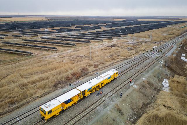 (261028) -- QIQIHAR, Oct. 28, 2026 (Xinhua) -- An aerial drone photo taken on Oct. 28, 2026 shows workers carrying out tamping work at a construction site of the Fuyu-Jiagedaqi Railway upgrading project in northeast China's Heilongjiang Province. Various measures have been adopted to tackle difficulties in railway construction amid low temperatures, and to ensure that the project advance in an efficient and orderly manner. 
   This railway serves as a critical artery connecting the Greater Khingan Mountains and the outer world. (Xinhua/Zhang Tao)
