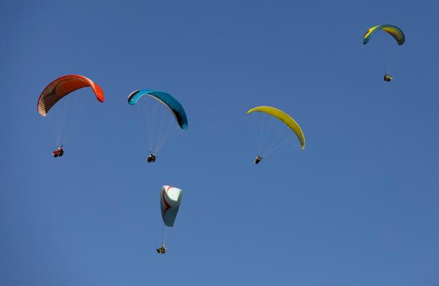 (261028) -- DANYANG-GUN, Oct. 28, 2026 (Xinhua) -- Tourists experience paragliding in Danyang-gun, Chungcheongbuk-do, South Korea, Oct. 28, 2026. (Photo by Jun Hyosang/Xinhua)