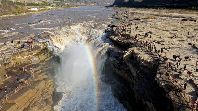(261028) -- JIXIAN, Oct. 28, 2026 (Xinhua) -- An aerial drone photo taken in Jixian County, north China's Shanxi Province, on Oct. 28, 2026, shows a rainbow over the Yellow River's Hukou Waterfall. (Photo by Lyu Guiming/Xinhua)